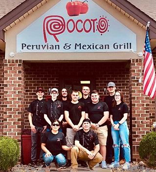 Rocoto team in front of Rocoto Red Lion.